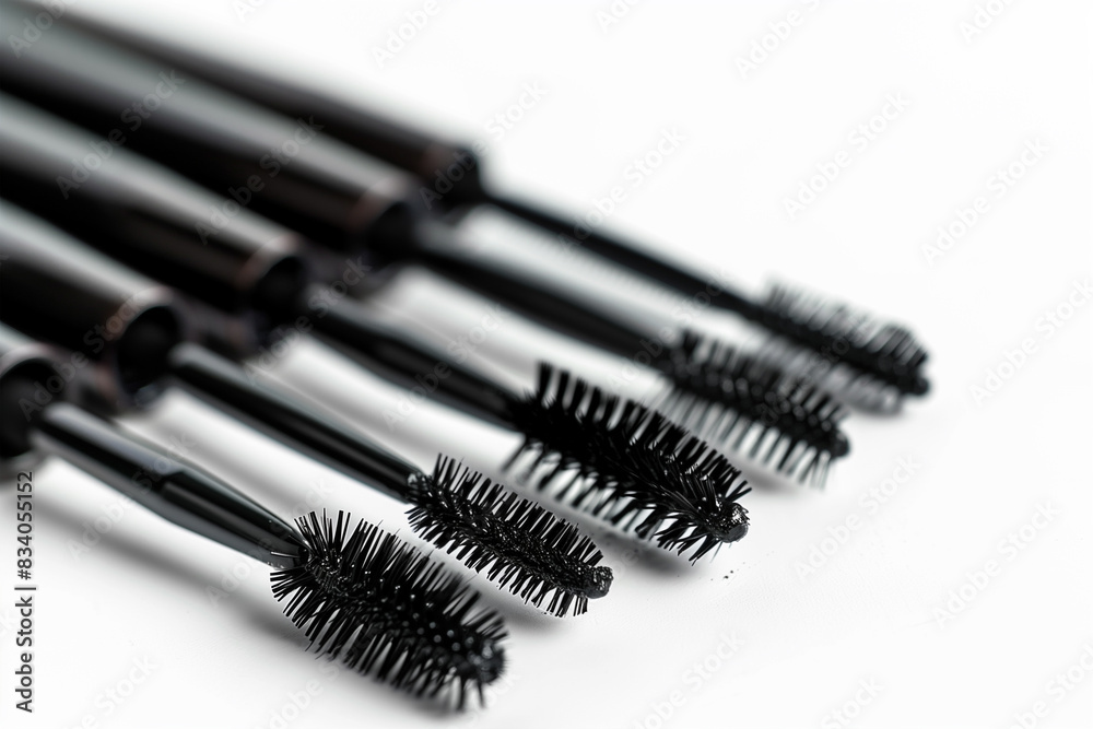 Group of Mascara Brushes on White Surface Group of Mascara Brushes on White Surface
