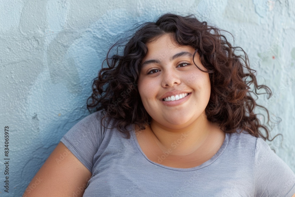 Fat Young Hispanic Woman Looking Happy in Casual Attire