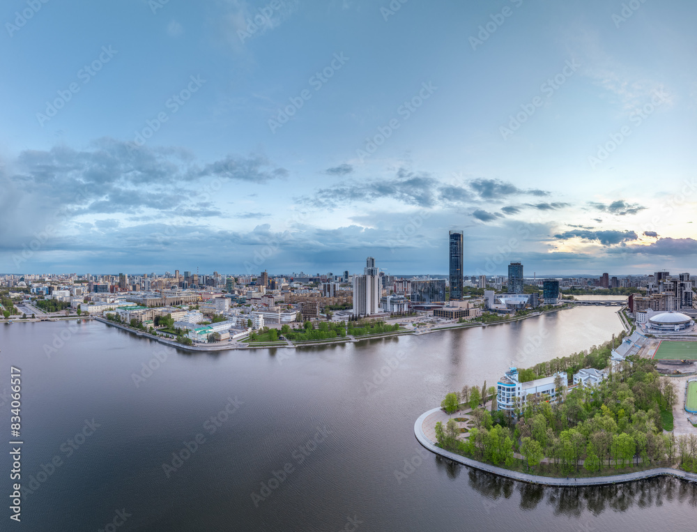 Yekaterinburg city with Buildings of Regional Government and Parliament, Dramatic Theatre, Iset Tower, Yeltsin Center, panoramic view at summer sunset. Yekaterinburg city with Buildings of Regional Government and Parliament, Dramatic Theatre, Iset Tower, Yeltsin Center, panoramic view at summer sunset.