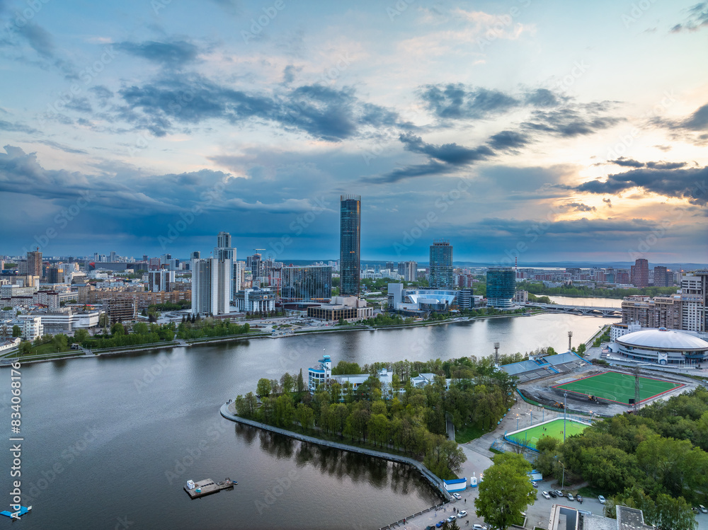Yekaterinburg city with Buildings of Regional Government and Parliament, Dramatic Theatre, Iset Tower, Yeltsin Center, panoramic view at summer sunset. Yekaterinburg city with Buildings of Regional Government and Parliament, Dramatic Theatre, Iset Tower, Yeltsin Center, panoramic view at summer sunset.
