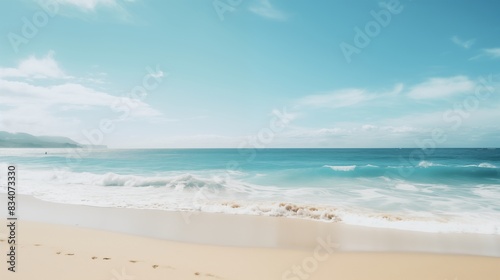 Serene Beach Scene with Gentle Waves and Clear Blue Sky