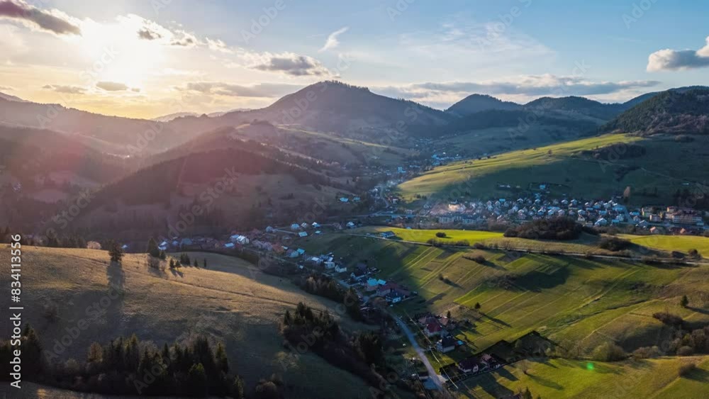 Aerial view of spring countryside at golden sunrise, hyper lapse