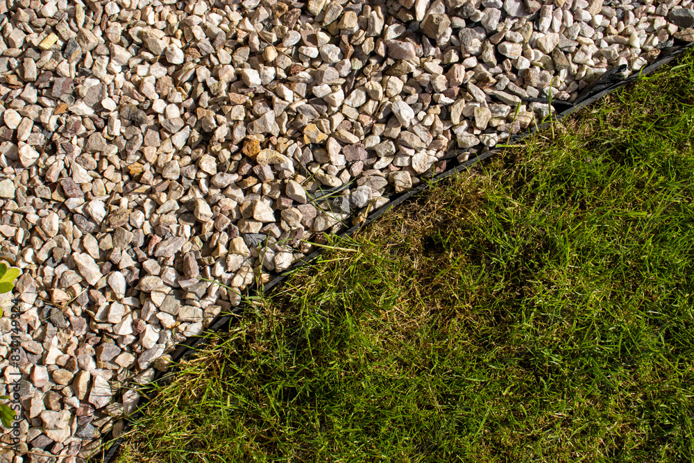 Corner of garden path. Gardening concept background. Lawn edge close up Corner of garden path. Gardening concept background. Lawn edge close up