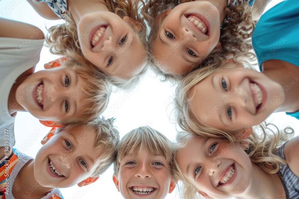 © vefimov - Group of kids gathered together in a circular formation
