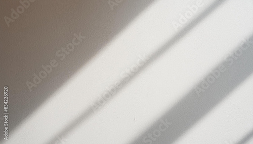 Blurred overlay effect for photo and mockups. Wall texture with organic drop diagonal shadow and rays of light on a white wall. shadows for natural light effects photo