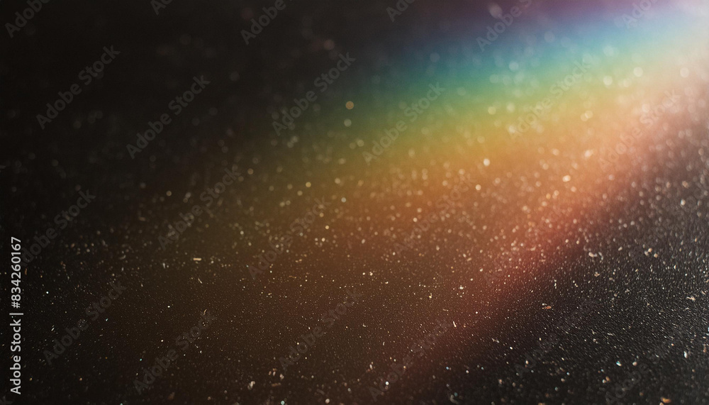 Blur colorful warm rainbow light leaks on black background with dust texture. Defocused abstract damaged scratched retro film analog effect for using over photos as overlay or screen filter Blur colorful warm rainbow light leaks on black background with dust texture. Defocused abstract damaged scratched retro film analog effect for using over photos as overlay or screen filter