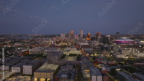 Mesmerizing aerial view of new orleans at dusk, with its glowing buildings and lively ambiance as night descends photo