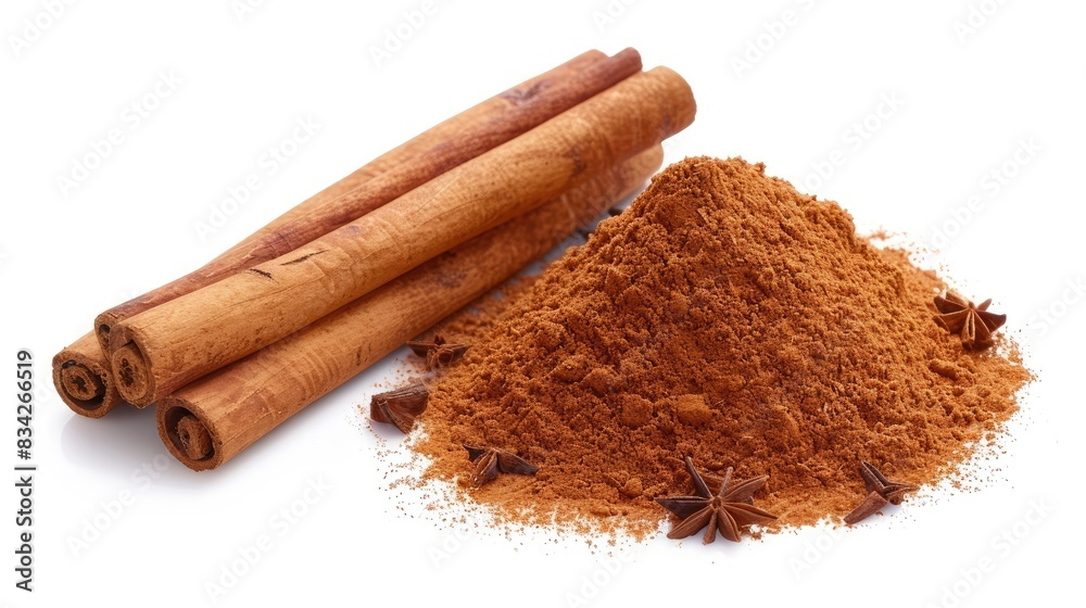 Aromatic Cinnamon Sticks and Ground Cinnamon in a White Background Display Aromatic Cinnamon Sticks and Ground Cinnamon in a White Background Display