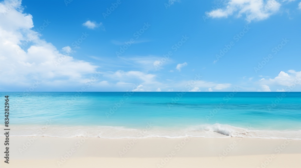 Scenic View of a Serene Beach with Clear Blue Water and a Sunny Sky Scenic View of a Serene Beach with Clear Blue Water and a Sunny Sky