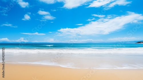A picturesque beach featuring clear blue skies  sandy shores  and gentle ocean waves