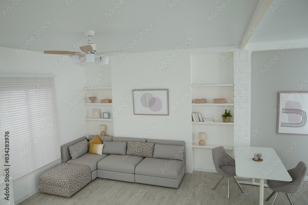 Ceiling fan, furniture and accessories in stylish living room, above view Ceiling fan, furniture and accessories in stylish living room, above view
