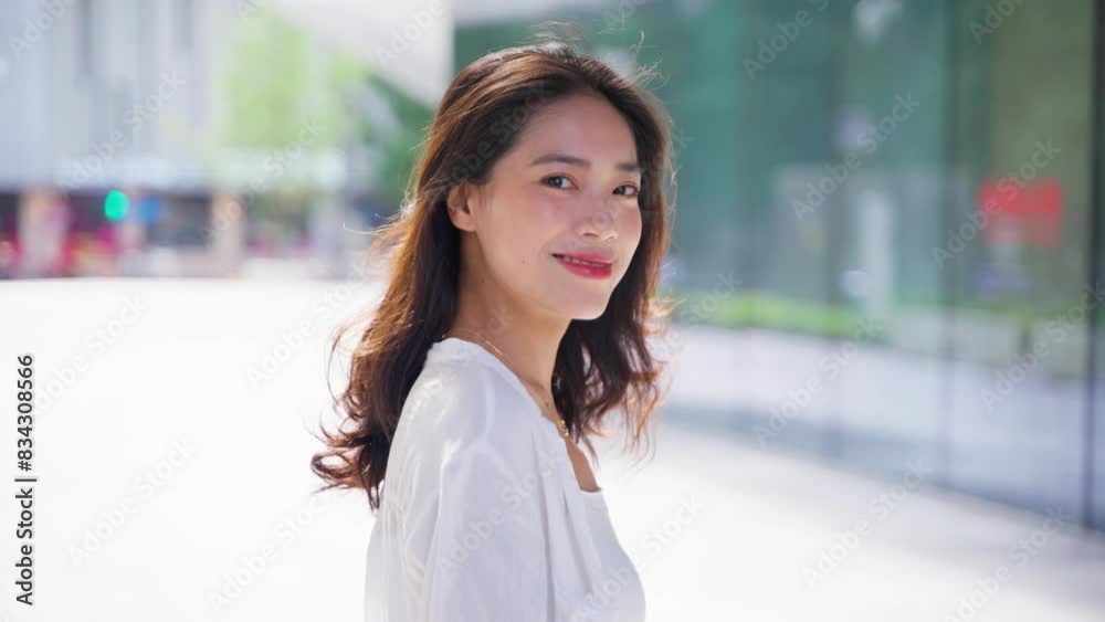 charming young lady looking at camera smile in the summer morning sunlight at urban city street charming young lady looking at camera smile in the summer morning sunlight at urban city street
