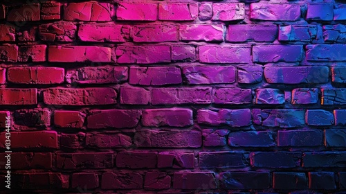 Colorful neon lit textured brick wall background with vibrant shades of purple  pink  red  and blue  perfect for modern urban designs.