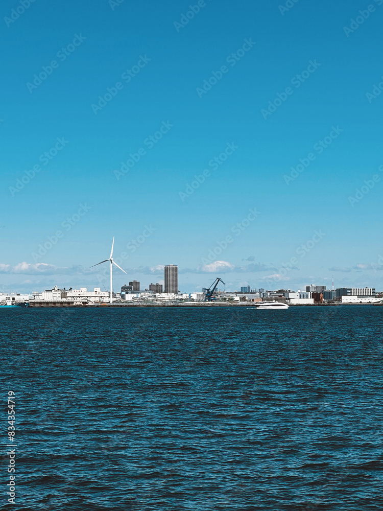 Yokohama, Japan. March 20, 2024: Urban landscape with modern buildings and blue sky of the city. Yokohama, Japan. March 20, 2024: Urban landscape with modern buildings and blue sky of the city.