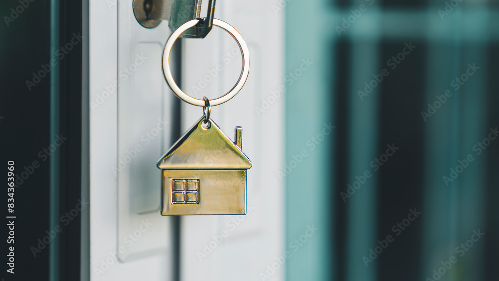 House model and key in house door. Real estate agent offer house, property insurance and security, affordable housing concepts