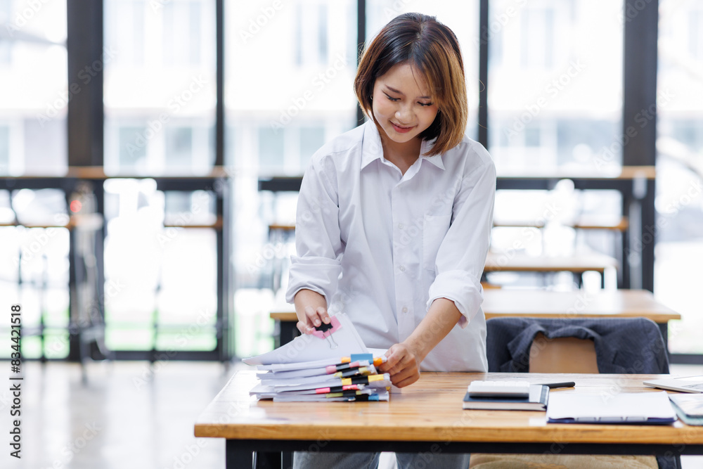 Obraz premium Business Documents, Auditor businesswoman checking searching document legal prepare paperwork or report for analysis TAX time,accountant Documents data contract partner deal in workplace office