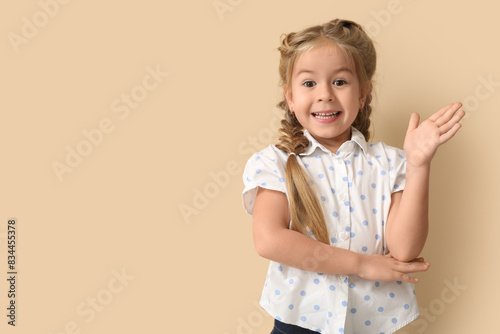 Happy little schoolgirl rai...