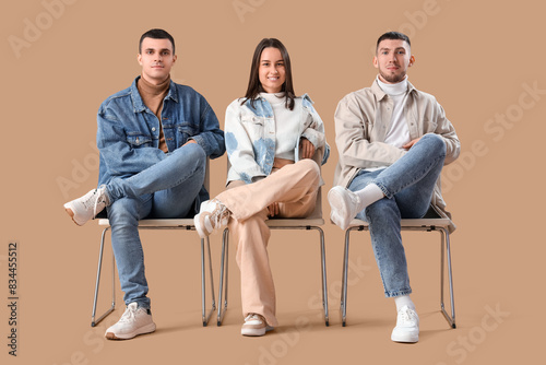 Stylish young people in den...