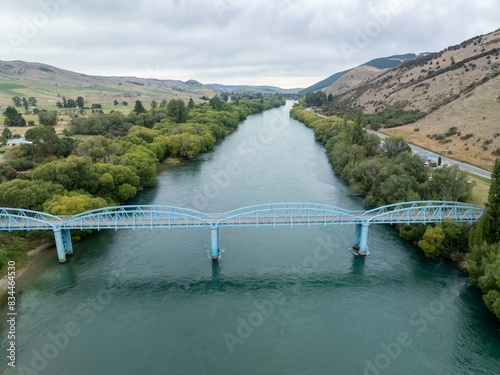 Bridge crossing the Clutha river in Ettrick-Raes Junction, Milllers Flat, Otago, New Zealand. photo