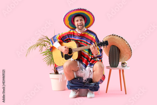 Mexican young man playing g...