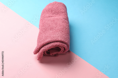 Roll of towel on blue pink background