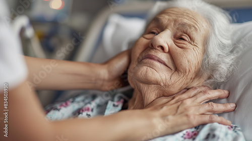 Old woman hospitalized, hand on chest photo