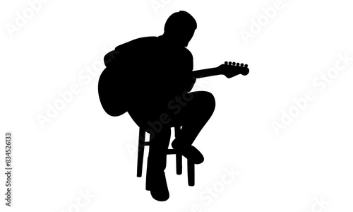 silhouette of man playing guitar