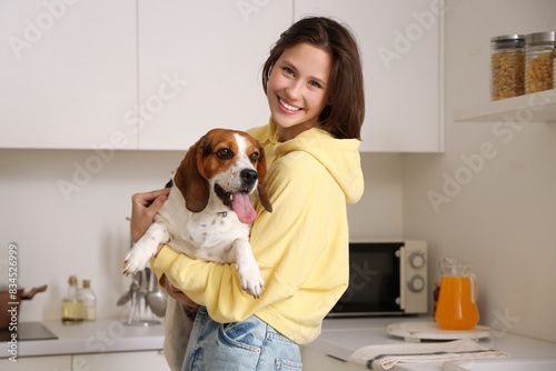 Young woman with Beagle dog...