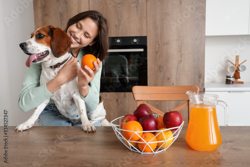 Young woman with orange and...