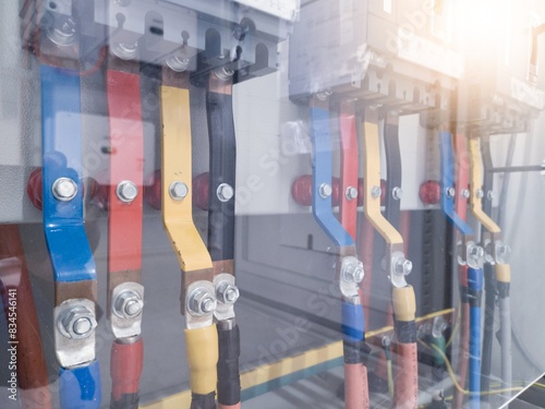 Installation of power line on main breaker panel for industrial power control.
