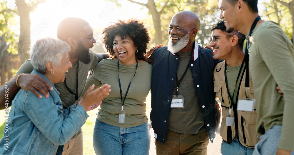 © peopleimages.com - Huddle, happy and volunteer group outdoor with collaboration, teamwork and donation for charity work. Hug, smile and ngo people in park with cooperation, commitment and community service for change