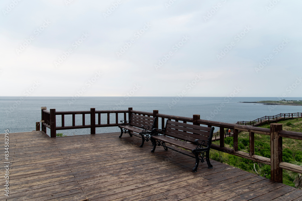 View of the wooden bench on the observatory at the seaside View of the wooden bench on the observatory at the seaside