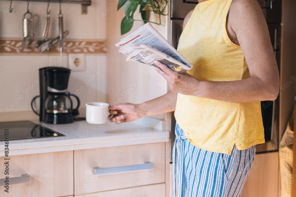 Starting The Day With Coffee And News.
Calm Morning Scene With A Female Person Pouring Coffee Into A Mug While Reading The Newspaper In The Kitchen.Morning Routine Concept Starting The Day With Coffee And News.
Calm Morning Scene With A Female Person Pouring Coffee Into A Mug While Reading The Newspaper In The Kitchen.Morning Routine Concept