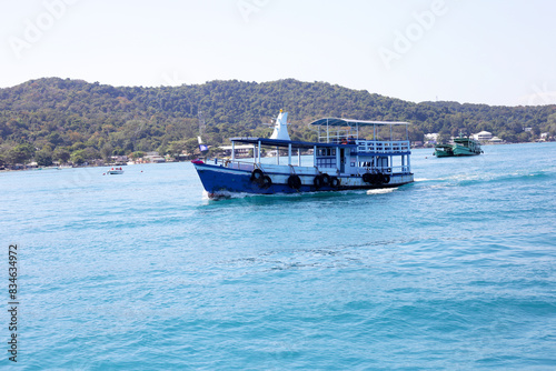 Ferry boat on the sea. Koh Salet, Thailand photo