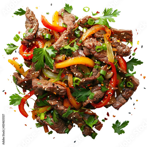Sautéed beef with bell peppers and herbs, top view on vibrant green background

 photo