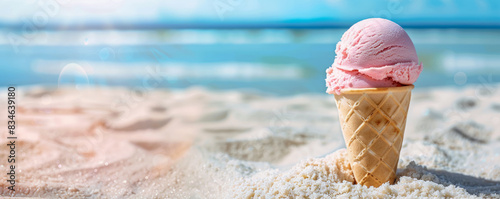 A summer ice cream in a cone on a beach