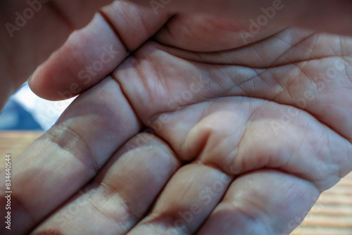 A hand attempting to block the camera lens to prevent a photo from being taken. This image captures the moment of privacy concern or an effort to stop unwanted photography