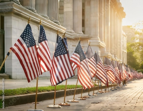 Row of American flags in a row on the sidewalk in a sunny day