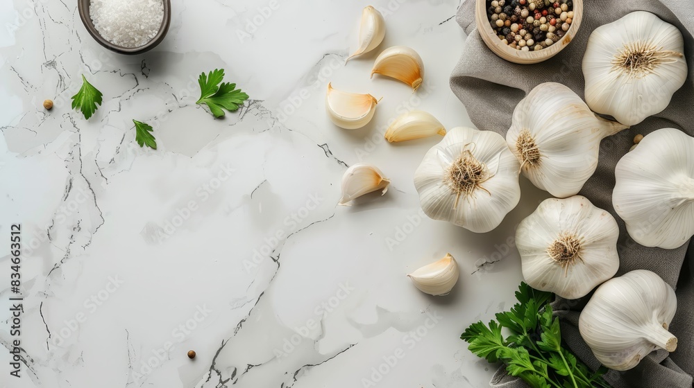 Garlic, parsley, and a bowl of parsley seeds on a marble counter top Garlic, parsley, and a bowl of parsley seeds on a marble counter top