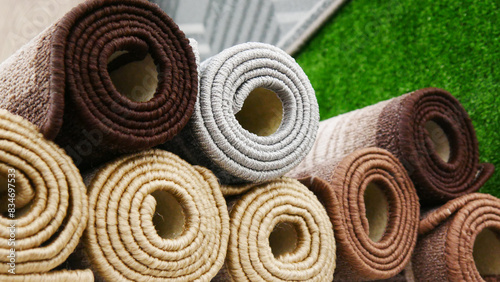 Close-up of beautiful rolled wool carpets on the market photo
