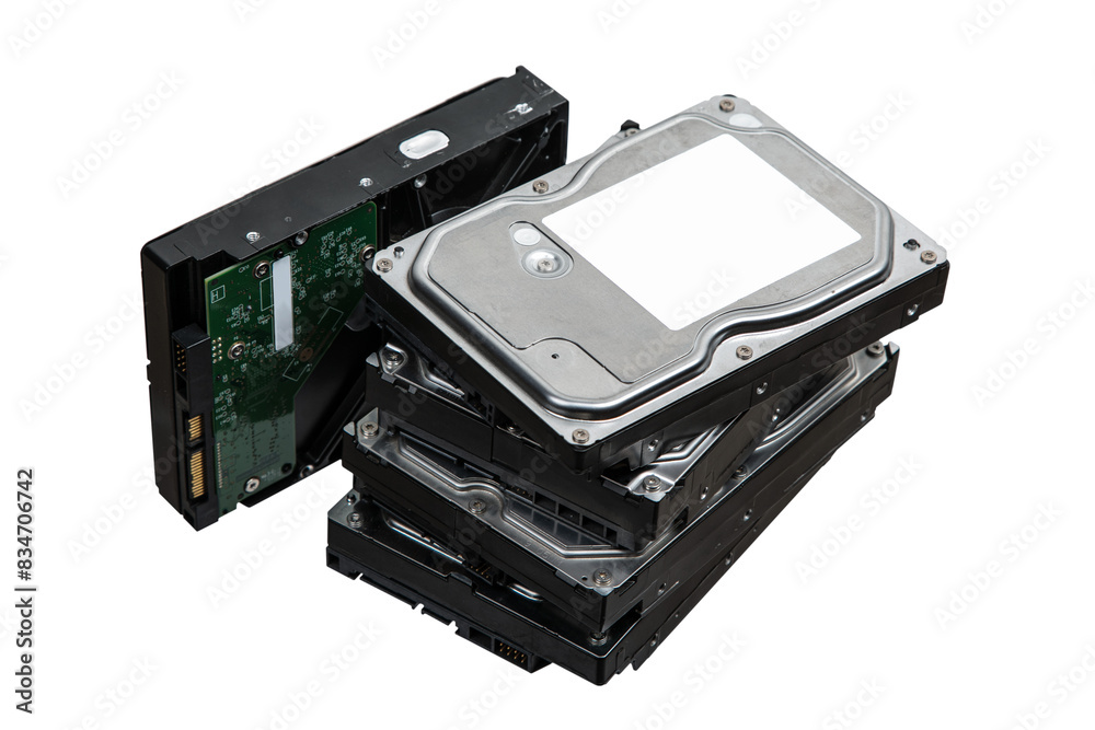 Hard drives stacked on top of each other. SATA 3.5 HDD for information storage. Isolate on a white back. Hard drives stacked on top of each other. SATA 3.5 HDD for information storage. Isolate on a white back.