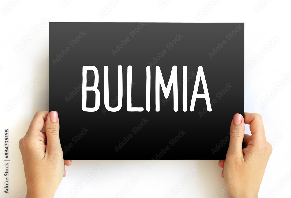 Bulimia is a serious, potentially life-threatening eating disorder, text on card health concept background Bulimia is a serious, potentially life-threatening eating disorder, text on card health concept background