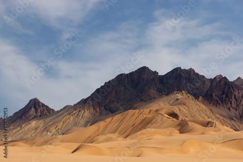 sandy mountains. large sandy mountains against blue sky with clouds, nature concept