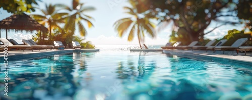 poolside scene at a luxurious tropical resort with rows of loungers under palm trees during sunset.