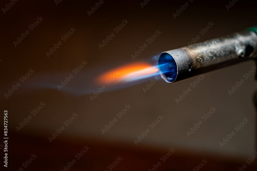 Fototapeta premium Blowtorch with blue and orange flame