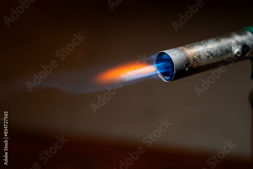 Blowtorch with blue and orange flame