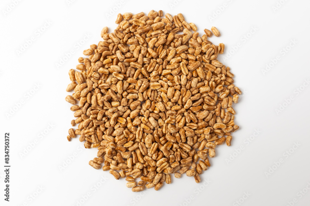 Roasted kamut on white background Roasted kamut on white background