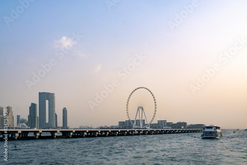 Photography DUBAI, UAE - May 1, 2024 : Bluewaters island with modern architecture and ferris wheel aerial