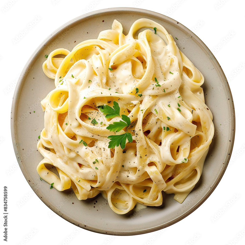 Fettuccine Alfredo on modern plate on isolated white background, top view Fettuccine Alfredo on modern plate on isolated white background, top view