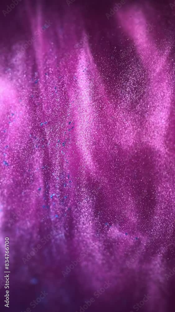 The hypnotic movement of purple and blue paints swirling in water is captured in vertical video frames, showcasing a mesmerizing liquid dance that is both captivating and visually stunning